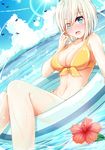  bikini bird blue_eyes blush breasts cleavage cloud day dutch_angle flower front-tie_top hamakaze_(kantai_collection) hibiscus highres igakusei innertube kantai_collection large_breasts looking_at_viewer navel ocean open_mouth partially_submerged short_hair silver_hair sky solo sparkle sunlight swimsuit water water_drop wavy_mouth wet yellow_bikini 