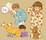  3girls antenna_hair arm_up black_eyes black_hair blue_pajamas blue_pants breast_pocket brown_background brown_hair closed_eyes closed_mouth collared_pajamas commentary drooling highres holding holding_stuffed_toy ipad long_sleeves looking_at_viewer lying mouth_drool multiple_girls on_stomach open_mouth original pajamas pants pocket short_hair sihyun25 simple_background sleeping speech_bubble spoken_zzz stuffed_animal stuffed_toy symbol-only_commentary tablet_pc teddy_bear white_pajamas white_pants yellow_pajamas yellow_pants zzz 