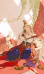  1girl animal_on_shoulder blonde_hair blouse blue_pants braid breasts cat chalice cleavage closed_mouth coin collarbone corset crescent_moon cup earrings facing_viewer food fruit gold_bracer gold_earrings grapes grin head_tilt high-waist_pants high_ponytail highres ibuki_satsuki jewelry long_hair medium_breasts moon original pants pitcher_(container) plant plate ponytail puffy_sleeves shirt short_sleeves single_braid sitting smile solo star_(symbol) sunlight tiara vines white_shirt 