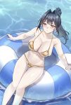  1girl absurdres alternate_costume bikini black_hair blue_eyes blush breasts cleavage closed_mouth commentary english_commentary gold_bikini hair_intakes highres hololive hololive_english innertube large_breasts long_hair looking_at_viewer navel nurizza_ilst on_innertube ouro_kronii ponytail revision sitting solo stomach string_bikini swim_ring swimsuit virtual_youtuber water 