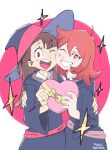  2girls :d ;d absurdres artist_name asymmetrical_bangs black_dress black_hat blush blush_stickers bow box bright_pupils cheek_press commentary dress english_commentary eyelashes grin hand_on_another's_arm hat heart-shaped_box highres holding hood hood_down hooded_dress kagari_atsuko little_witch_academia long_hair long_sleeves looking_at_viewer mangodevourer medium_hair multiple_girls one_eye_closed open_mouth red_eyes red_hair shiny_chariot smile teeth upper_teeth_only valentine white_pupils witch_hat yellow_bow 