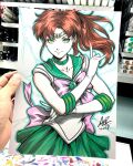  1girl art_tools_in_frame artist's_hand_in_frame bishoujo_senshi_sailor_moon blue_outline bow brown_hair choker closed_mouth collarbone commentary english_commentary gem gloves green_choker green_eyes green_gem green_sailor_collar green_skirt highres kino_makoto looking_at_viewer marker_(medium) outline photo_(medium) pink_bow sailor_collar sailor_jupiter sailor_senshi_uniform signature skirt smile solo stanley_lau tiara traditional_media white_background white_gloves 