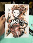  1girl art_tools_in_frame artist's_hand_in_frame black_gloves blank_eyes bodysuit breasts closed_mouth commentary english_commentary facing_viewer fiery_hair gloves highres jean_grey long_hair marker_(medium) marvel photo_(medium) red_bodysuit red_hair signature solo stanley_lau traditional_media upper_body x-men 