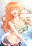  1girl bare_arms bare_shoulders belt belt_buckle bikini bikini_top_only blue_pants breasts buckle cleavage collarbone commentary denim eyelashes green_bikini halterneck hand_up highres iamomelet jeans large_breasts long_hair looking_at_viewer nami_(one_piece) navel one_eye_closed one_piece open_mouth orange_eyes orange_hair pants smile solo stomach swimsuit teeth upper_body upper_teeth_only water 