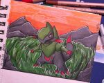  alanacrafty7 black_sclera claws colored_sclera colored_skin commentary fraxure grass green_skin grey_skin highres looking_at_viewer multicolored_skin no_humans pencil photo_(medium) pokemon pokemon_(creature) red_eyes sketchbook solo tail traditional_media two-tone_skin 