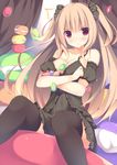  1girl black_dress black_legwear blonde_hair blush breasts cleavage dress food highres large_breasts long_hair macaron megarisu multicolored multicolored_eyes original purple_eyes red_eyes sitting solo thighhighs two_side_up 