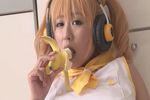  1girl asian banana blonde_hair breasts cosplay food fruit headphones kitamura_hitomi mizuki_tama nitroplus photo plump solo super_pochaco super_pochaco_(cosplay) twintails 