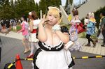 1girl asian blonde_hair breasts brown_eyes cleavage cosplay fat headphones hoshima_mika huge_breasts jewelry maid maid_headdress necklace nitroplus photo plump solo star super_pochaco super_pochaco_(cosplay) tattoo thighhighs twintails wrist_cuffs 