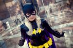  1girl aigue_marine batgirl batman_(series) blonde_hair cape cosplay dc_comics gloves photo solo stephanie_brown 