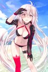  1girl antenna_hair bangs beach bikini black_bikini black_gloves blue_sky blurry blurry_background blush breasts brown_eyes cleavage cloud collarbone commentary_request day depth_of_field fate/grand_order fate_(series) gloves gluteal_fold halterneck hand_on_own_knee hand_up jeanne_d&#039;arc_(alter_swimsuit_berserker) jeanne_d&#039;arc_(fate)_(all) large_breasts leaning_forward leg_belt legs_apart long_hair looking_at_viewer m-ya navel o-ring o-ring_top ocean outdoors parted_lips red_legwear shading_eyes shrug_(clothing) single_thighhigh sky solo standing swimsuit teeth thighhighs twitter_username very_long_hair water white_hair 