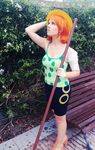  1girl breasts camisole cosplay hot large_breasts nami nami_(cosplay) nami_(one_piece) nami_(one_piece)_(cosplay) one_piece orange_hair photo shorts solo staff 