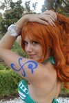  1girl bikini bodypaint breasts cosplay large_breasts nami nami_(cosplay) nami_(one_piece) nami_(one_piece)_(cosplay) nice one_piece orange_hair photo sexy solo swimsuit 