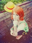  1_girl 1girl breasts camisole cosplay hat hot large_breasts nami nami_(cosplay) nami_(one_piece) nami_(one_piece)_(cosplay) one_piece orange_hair photo sandals short_hair shorts solo straw_hat 