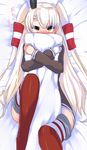  amatsukaze_(kantai_collection) blonde_hair blush body_pillow brown_dress dress hair_tubes hairband kantai_collection long_hair looking_at_viewer lying on_back pillow pillow_hug red_legwear solo striped striped_legwear tenken_(gotannda) thighhighs two_side_up yellow_eyes 