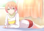  blush curtains green_eyes hoshizora_rin looking_at_viewer love_live! love_live!_school_idol_project lying on_stomach orange_hair scarf short_hair shorts smile solo window yuki_(sangeki5806) 