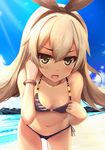  bare_shoulders beach bikini blonde_hair blue_sky blush bow bracelet cloud day fang green_eyes hair_bow hairband jewelry kantai_collection leaning_forward long_hair looking_at_viewer navel open_mouth outdoors rods shimakaze_(kantai_collection) side-tie_bikini sky solo sunlight swimsuit 