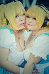  2girls asian blonde_hair breasts cosplay fat headphones huge_breasts luu_(cosplayer) multiple_girls necklace nitroplus photo replica_doll star super_pochaco super_pochaco_(cosplay) 
