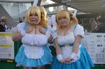  2girls asian blonde_hair breasts cosplay fat headphones huge_breasts luu_(cosplayer) multiple_girls necklace nitroplus photo replica_doll star super_pochaco super_pochaco_(cosplay) 