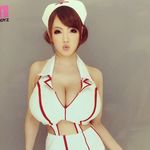  1girl asian breasts brown_hair hitomi_tanaka huge_breasts nurse photo solo 