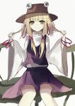  1girl bangs beckzawachi blonde_hair bracelet brown_hat closed_mouth eyebrows_visible_through_hair hair_between_eyes hands_up hat highres holding holding_hair jewelry legs_apart lily_pad long_hair long_sleeves looking_at_viewer moriya_suwako orange_eyes purple_skirt purple_vest shirt simple_background sitting skirt solo touhou vest white_background white_shirt wide_sleeves 