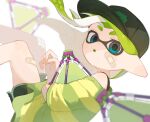  1girl bandaid bandaid_on_cheek bandaid_on_face bandaid_on_leg baseball_cap blue_eyes blurry blurry_background blurry_foreground commentary dolphin_shorts green_hair green_hat green_shirt green_shorts hat highres inkling inkling_girl inkling_player_character long_hair looking_at_viewer open_mouth pointy_ears print_hat sabata_saba shirt short_eyebrows shorts solo splat_bomb_(splatoon) splatoon_(series) splatoon_3 tentacle_hair thick_eyebrows 