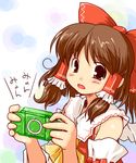  bow brown_hair hair_bow hakurei_reimu handheld_game_console hands kanoe_soushi playing_games playstation_portable red_bow solo touhou 