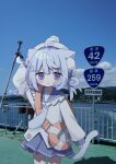  1girl :o ahoge anchor_hair_ornament animal_ear_fluff animal_ears arm_behind_head arm_up beret blue_eyes blue_hair blue_necktie blue_sailor_collar blue_skirt blue_sky blush cat_ears cat_girl cat_tail cloud commentary day frilled_sailor_collar frills hair_ornament hat highres long_sleeves mie_prefecture nakkar necktie original outdoors parted_lips photo_background pleated_skirt puffy_long_sleeves puffy_sleeves real_world_location sailor_collar shirt sign skirt sky sleeves_past_wrists solo tail untranslatable_commentary water white_hat white_shirt 