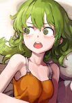  1girl :o bare_shoulders blush breasts camisole collarbone commentary constricted_pupils embarrassed eyelashes green_eyes green_hair hair_between_eyes highres igarashi_futaba jun_(navigavi) lying medium_hair nose_shade on_bed on_side orange_camisole petite pillow senpai_ga_uzai_kouhai_no_hanashi small_breasts solo surprised teeth upper_body upper_teeth_only v-shaped_eyebrows 