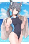  1girl animal_ear_fluff animal_ears black_one-piece_swimsuit blue_archive blue_eyes blue_halo blush breasts cloud cloudy_sky commentary_request competition_swimsuit covered_navel cross cross_hair_ornament earrings extra_ears hair_between_eyes hair_ornament halo highleg highleg_one-piece_swimsuit highres holding holding_towel inverted_cross jewelry low_ponytail medium_breasts mismatched_pupils multicolored_swimsuit nyakonro_(nekonro) ocean official_alternate_costume one-piece_swimsuit ponytail shiroko_(blue_archive) shiroko_(swimsuit)_(blue_archive) sky smile swimsuit towel two-tone_swimsuit wet wet_clothes wet_swimsuit wolf_ears wolf_girl 