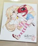  1girl backpack bag blonde_hair blush charm_(object) commentary_request crop_top flat_chest full_body highres kodomo_no_jikan kokonoe_rin kumamon long_hair looking_at_viewer one_eye_closed photo_(medium) randoseru shikishi shoes short_shorts shorts smile solo striped_clothes striped_thighhighs thighhighs traditional_media twintails uwabaki v watashiya_kaworu 