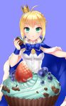  ahoge artoria_pendragon_(all) blonde_hair blue_cape blueberry bow cape crown cupcake eating fate/stay_night fate_(series) food food_on_face fruit green_eyes highres momoayamo saber solo strawberry 