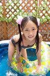  asian black_hair hair_ornament innertube junior_idol photo pool swimsuit twintails water wet yuumi 