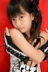  1girl ai_chan asian black_hair crossed_arms gothic_lolita highres junior_idol lolita_fashion photo red_background 