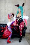  2girls asian breasts capcom chouzuki_maryou cosplay large_breasts lilith_aensland lilith_aensland_(cosplay) morrigan_aensland morrigan_aensland_(cosplay) multiple_girls photo plump suzuka_itsuki vampire_(game) 