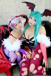  2girls asian breasts capcom chouzuki_maryou cosplay large_breasts lilith_aensland lilith_aensland_(cosplay) morrigan_aensland morrigan_aensland_(cosplay) multiple_girls photo plump suzuka_itsuki vampire_(game) 