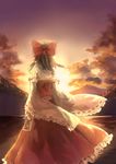  absurdres bow brown_hair cloud detached_sleeves from_behind hair_bow hair_tubes hakurei_reimu hankon highres landscape long_sleeves mountain ribbon-trimmed_sleeves ribbon_trim scenery shirt skirt skirt_set sky solo spell_card star_(sky) sunset touhou wide_sleeves 