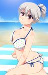  alternate_hairstyle beach bikini blanket blue_sky breasts cleavage collarbone commentary_request day hayashi_custom highres izayoi_sakuya large_breasts looking_at_viewer multi-strapped_bikini ocean outdoors polka_dot polka_dot_bikini polka_dot_swimsuit ponytail red_eyes scrunchie silver_hair sitting sky solo swimsuit touhou wariza 