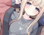  1girl arm_up blue_eyes blush breasts brown_hair closed_mouth collarbone commentary_request grey_shirt long_hair long_sleeves looking_at_viewer lying ominaeshi_(takenoko) on_back open_clothes original pillow shirt sleeves_past_wrists small_breasts solo upper_body 