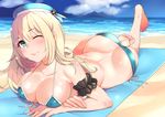  atago_(kantai_collection) barefoot beach bikini blonde_hair breasts day feet green_eyes hat kantai_collection kyuuso_inukami large_breasts leg_up long_hair lying on_stomach one_eye_closed smile soles solo swimsuit the_pose toes 