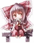  bad_id bad_pixiv_id barefoot black_hair bow brown_eyes detached_sleeves dress eating food food_on_face hair_bow hair_tubes hakurei_reimu long_sleeves onigiri red_dress shunsuke sitting solo touhou wide_sleeves 