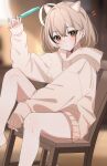  1girl absurdres ahoge alternate_costume animal_ears bare_legs blurry blurry_background brown_eyes brown_hair brown_hoodie cat_ears closed_mouth commentary crossed_bangs dot_mouth food hana20000920 highres holding holding_food holding_popsicle hololive hololive_english hood hoodie huge_ahoge indoors light_rays looking_at_viewer naked_hoodie nanashi_mumei notice_lines official_alternate_hair_length official_alternate_hairstyle piercing popsicle short_hair sitting sleeves_past_wrists solo sweat symbol-only_commentary virtual_youtuber wooden_chair 