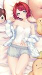  1girl ange_katrina ange_katrina_(6th_costume) ayuko_ammobium banken_(inui_toko) bare_shoulders blue_cardigan blue_eyes breasts camisole cardigan cardigan_partially_removed character_doll cleavage collarbone commentary_request cowboy_shot doll front-tie_shorts grey_shorts groin hair_intakes hair_ornament hairclip hand_on_own_stomach hand_up highres looking_at_viewer mandragora_(ange_katrina) nijisanji on_bed parted_lips pillow red_hair sebastian_piyodore short_hair shorts sleeves_past_wrists small_breasts solo strap_slip striped_cardigan stuffed_animal stuffed_toy swept_bangs virtual_youtuber white_camisole 