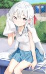  1girl absurdres arm_support bare_arms bare_shoulders blue_skirt breasts chain-link_fence commentary_request feet_out_of_frame fence grey_eyes hamaken._(novelize) highres holding holding_towel imouto-chan_(hamaken.) long_hair looking_at_viewer original pleated_skirt racket shirt sitting skirt sleeveless sleeveless_shirt small_breasts solo sportswear tennis_racket tennis_uniform towel white_hair white_shirt wiping_sweat 