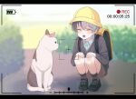  1boy aged_down aoyagi_touya backpack bag battery_indicator black_shoes blue_hair brown_shorts cat child closed_eyes collared_shirt commentary day hands_on_own_knees hat highres letterboxed long_sleeves male_focus mole mole_under_eye multicolored_hair open_mouth outdoors project_sekai shirt shoelaces shoes short_hair shorts socks solo split-color_hair squatting teeth two-tone_hair untranslatable_commentary upper_teeth_only v_prsk viewfinder wing_collar yawning yellow_hat 