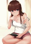  bangs bare_shoulders blue_eyes breasts brown_hair cleavage closed_mouth curtains grey_no_haru hand_on_own_chest handheld_game_console highres indian_style long_hair medium_breasts original playstation_vita shorts sitting solo strap_slip tank_top 