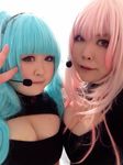  2girls aqua_hair asian breasts cleavage fat headset huge_breasts looking_at_viewer luu_(cosplayer) multiple_girls photo pink_hair replica_doll smile 