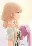  blonde_hair clothes_writing dated from_side futaba_anzu hair_over_shoulder idolmaster idolmaster_cinderella_girls long_hair low_twintails nagian profile shirt solo stuffed_animal stuffed_bunny stuffed_toy t-shirt twintails you_work_you_lose 