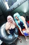  2girls aqua_hair asian breasts cleavage fat garter_straps headset heart huge_breasts looking_at_viewer luu_(cosplayer) multiple_girls photo pink_hair replica_doll smile 