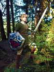  armor belt blonde_hair blue_eyes boots chainmail cosplay forest hat likovacs link nature outdoors photo pointy_ears shield solo standing sword the_legend_of_zelda the_legend_of_zelda:_twilight_princess tree twilight_princess 