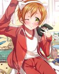  animal_ears arihara_(arhr0) cat_ears controller game_controller gamepad gym_shirt hoshizora_rin jacket love_live! love_live!_school_idol_project one_eye_closed open_clothes open_jacket orange_hair pants shirt short_hair solo track_suit yellow_eyes 